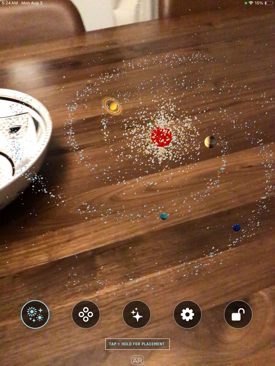 Galaxy AR IMG 4501 iPad interface showing the full galaxy and solar system placed over a table