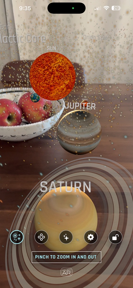 Current Galaxy AR iPhone interface showing the Sun, Jupiter, Saturn, planet labels, and bottom navigation